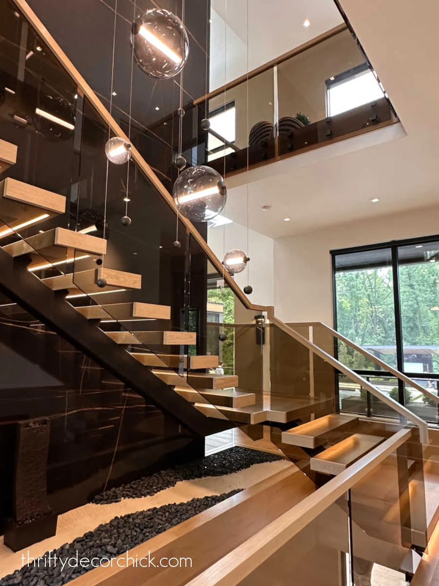 open staircase against black stone